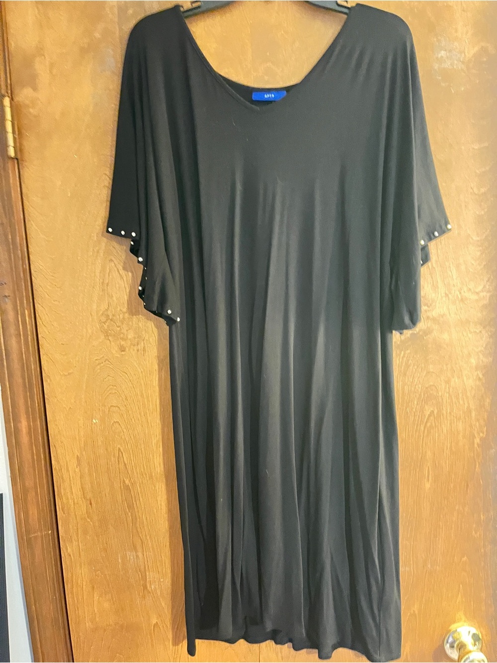 Women’s black dress with pearls